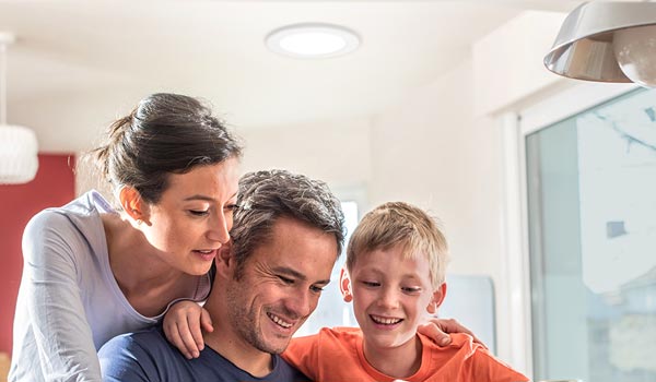 family under Natural Light tubular skylight mobile